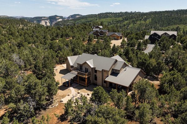 Aerial view of the house with Zion Park in the background