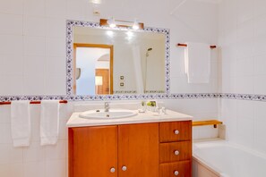 Bathtub, hair dryer, towels