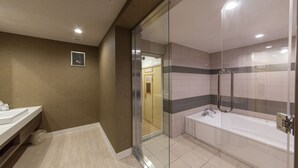 A modern bathroom with a glass-enclosed shower, a separate bathtub, and a vanity with a sink. - Hotel Sylph - Adults Only (Wakayama)