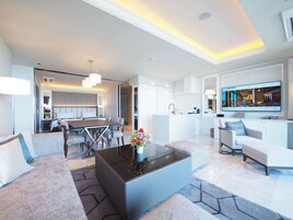 Luxury Suite, Non Smoking | Down comforters, in-room safe, blackout drapes, soundproofing