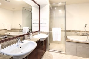 Bathtub, towels, soap, shampoo