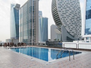 Outdoor pool - Dashing 2BR Apartment in Business Bay - Sleeps 5! (Dubai)