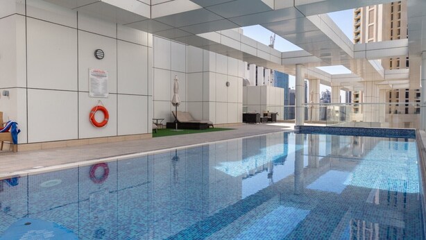 Outdoor pool - High Quality Living in This 2BR Apt in Downtown Dubai - Sleeps 6! (Dubai)