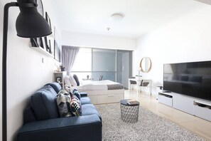 Laptop workspace, iron/ironing board, WiFi, bed sheets - Chic and Comfy Studio in the Heart of Jlt! (Dubai)