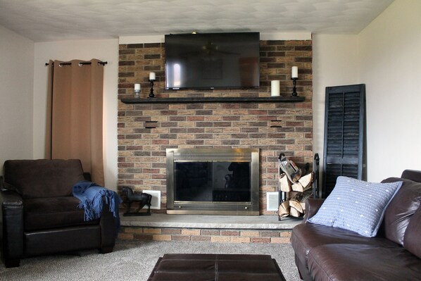 Smart TV, fireplace, books