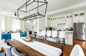 Enjoy meals in the dining area with a wooden table and comfortable seating for six.