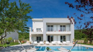 A modern two-story house with a swimming pool, outdoor seating, and a garden. - Exquisite Villa in Stanisovi With Swimming Pool (Rasa)