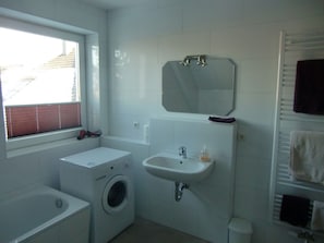 Bathtub, hair dryer, towels