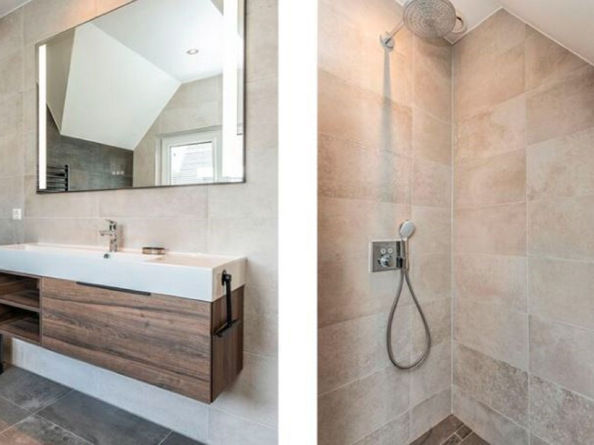 A modern bathroom with a wooden vanity, a large mirror, and a shower area with a control panel.