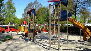 A playground with various play structures including slides and climbing frames. - Spacious Holiday Home in Eersel With Open Fire (Eersel)