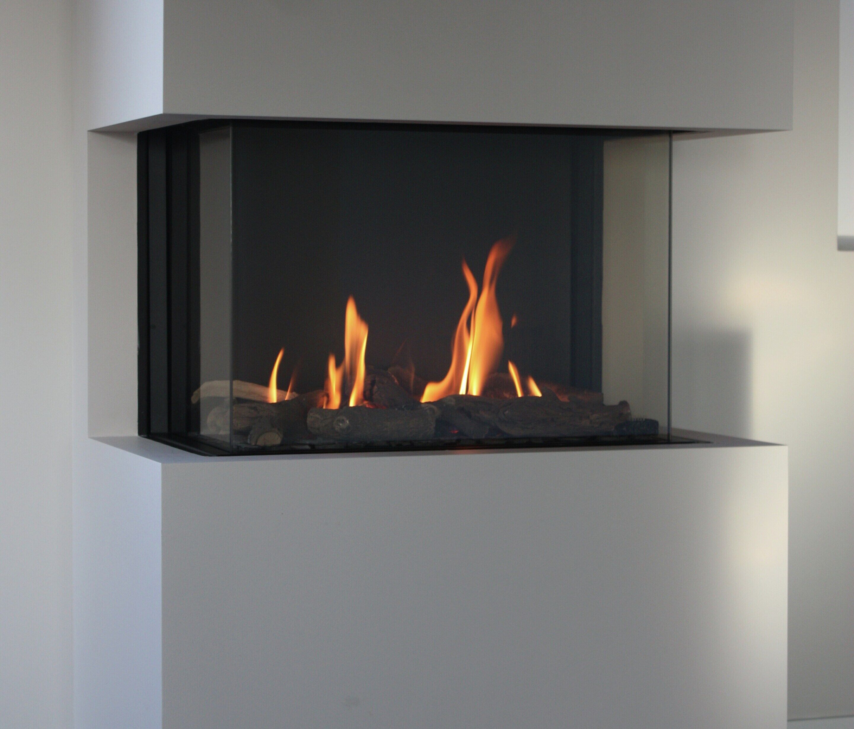 A modern fireplace with a clean, minimalist design, featuring a rectangular glass front and a simple, straight-lined structure.