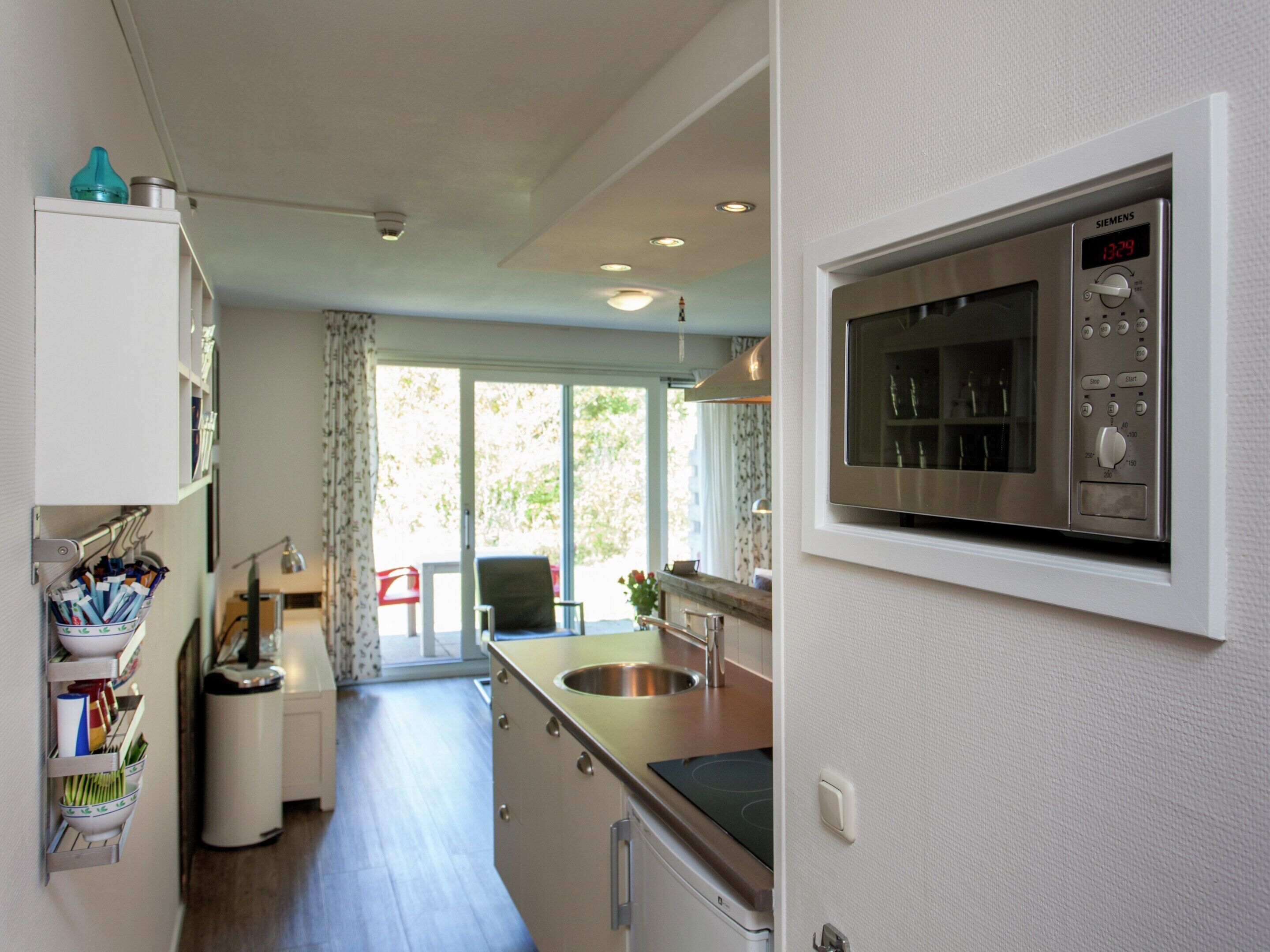 Apartment | Private kitchen | Fridge, microwave, coffee/tea maker, highchair