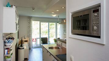 Apartment | Private kitchen | Fridge, microwave, coffee/tea maker, highchair