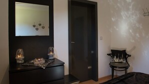 A room with a dark-colored dresser, a mirror, and a door. - Holiday Home in Stoumont near Town of Spa (Stoumont)