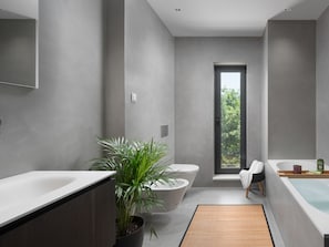 Villa | Bathroom | Bathtub, hair dryer, towels