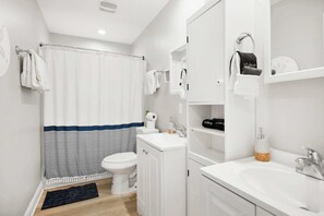 Bathtub, hair dryer, towels
