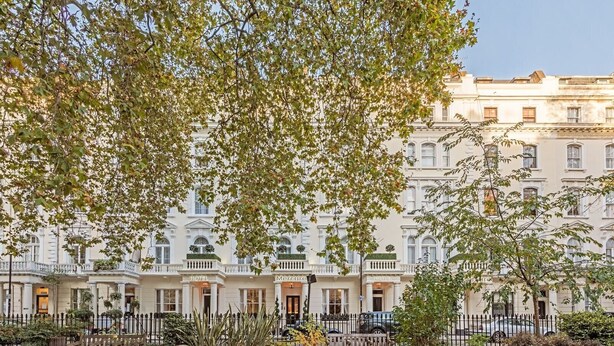 A row of white, multi-story buildings with balconies, labeled as hotels. - 12 London Street Apartments (London)