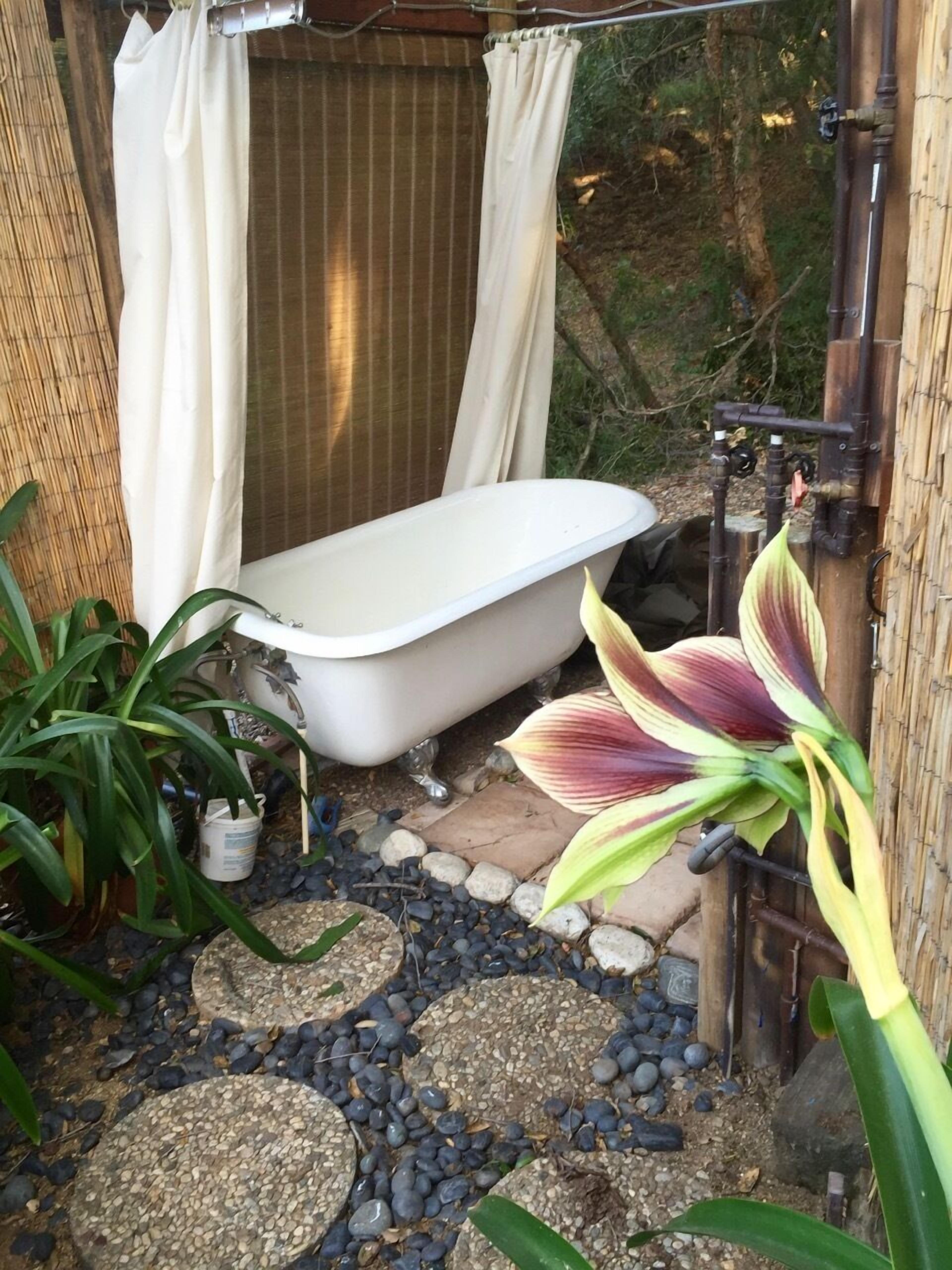outdoor shower and bathtub