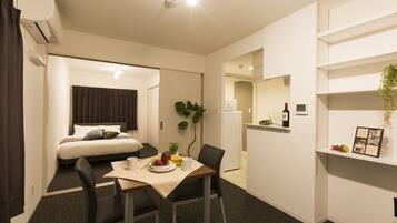 Deluxe Apartment | Living area | TV