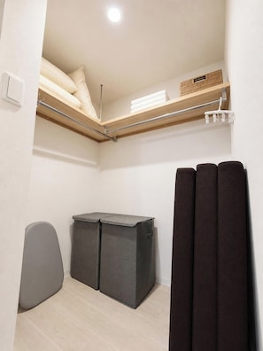 A compact room with a loft bed, a small seating area, and a storage unit. - Hotel ONE'S RESIDENCE (Sapporo)