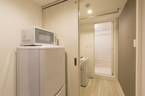 Apartament Deluxe | Bany | Combinació de dutxa i banyera i assecador de cabells
