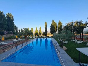Seasonal outdoor pool, pool umbrellas, pool loungers