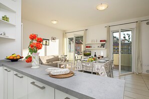 Family Apartment, Multiple Bedrooms (Torbole Relax, Pool & Balcony) | Dining