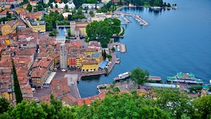 A coastal town with historic buildings, a marina, and a river.