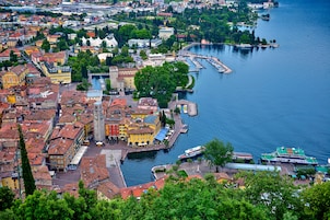 A coastal town with historic buildings, a marina, and a river.