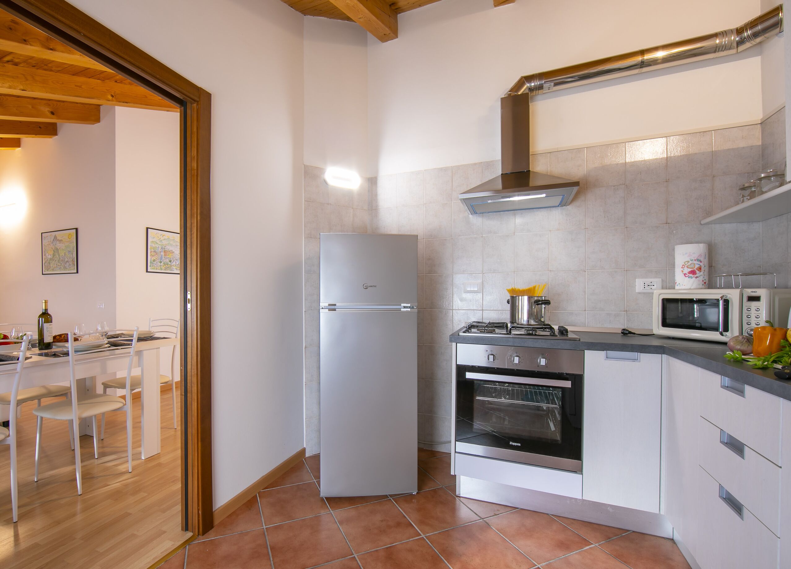 Family Apartment, Multiple Bedrooms (Residenza al Ponte) | Private kitchen | Full-sized fridge, microwave, oven, stovetop
