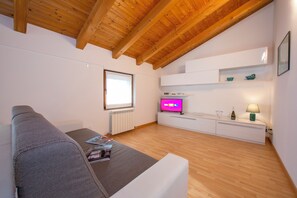 Family Apartment, Multiple Bedrooms (Residenza al Ponte) | Living area | 22-inch flat-screen TV with digital channels, TV - Residenza al Ponte (Arco)