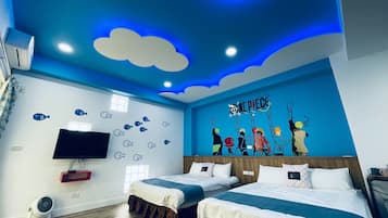 A modern hotel room with two beds, a mural of One Piece characters, and a blue ceiling with cloud designs.
