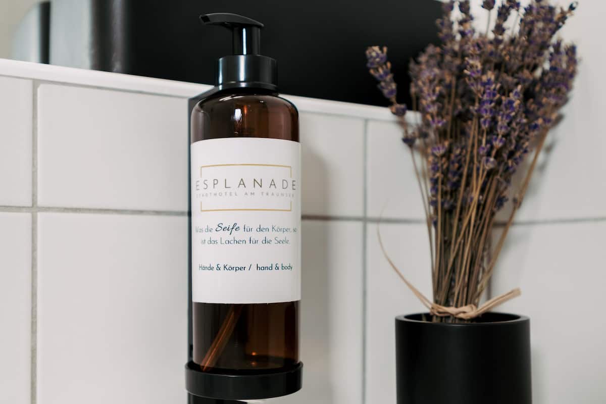 separate bathtub and shower, deep-soaking bathtub, hair dryer, towels