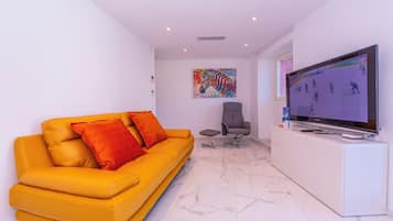 Family Apartment, Multiple Bedrooms, 2 Bathrooms (Red And Yellow Apartments) | Living area | 32-inch flat-screen TV with digital channels, TV