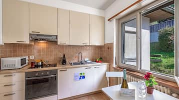 Family Apartment, 2 Bedrooms, Balcony, Lakeside (Garden on the lake 2) | Private kitchen | Full-size fridge, microwave, oven, stovetop