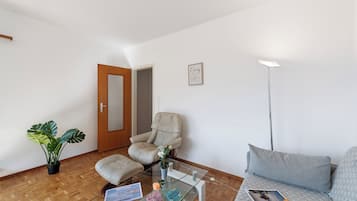 Family Apartment, 2 Bedrooms, Balcony, Lakeside (Garden on the lake 2) | Living area | 22-inch flat-screen TV with cable channels, TV