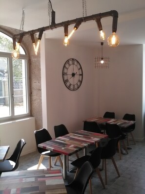 Enjoy meals in this stylish dining area with a U-shaped table and comfortable seating.