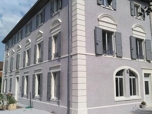 Classic building with a symmetrical facade and evenly spaced windows.