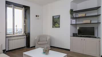 Apartment, 3 Bedrooms | Living area | Flat-screen TV