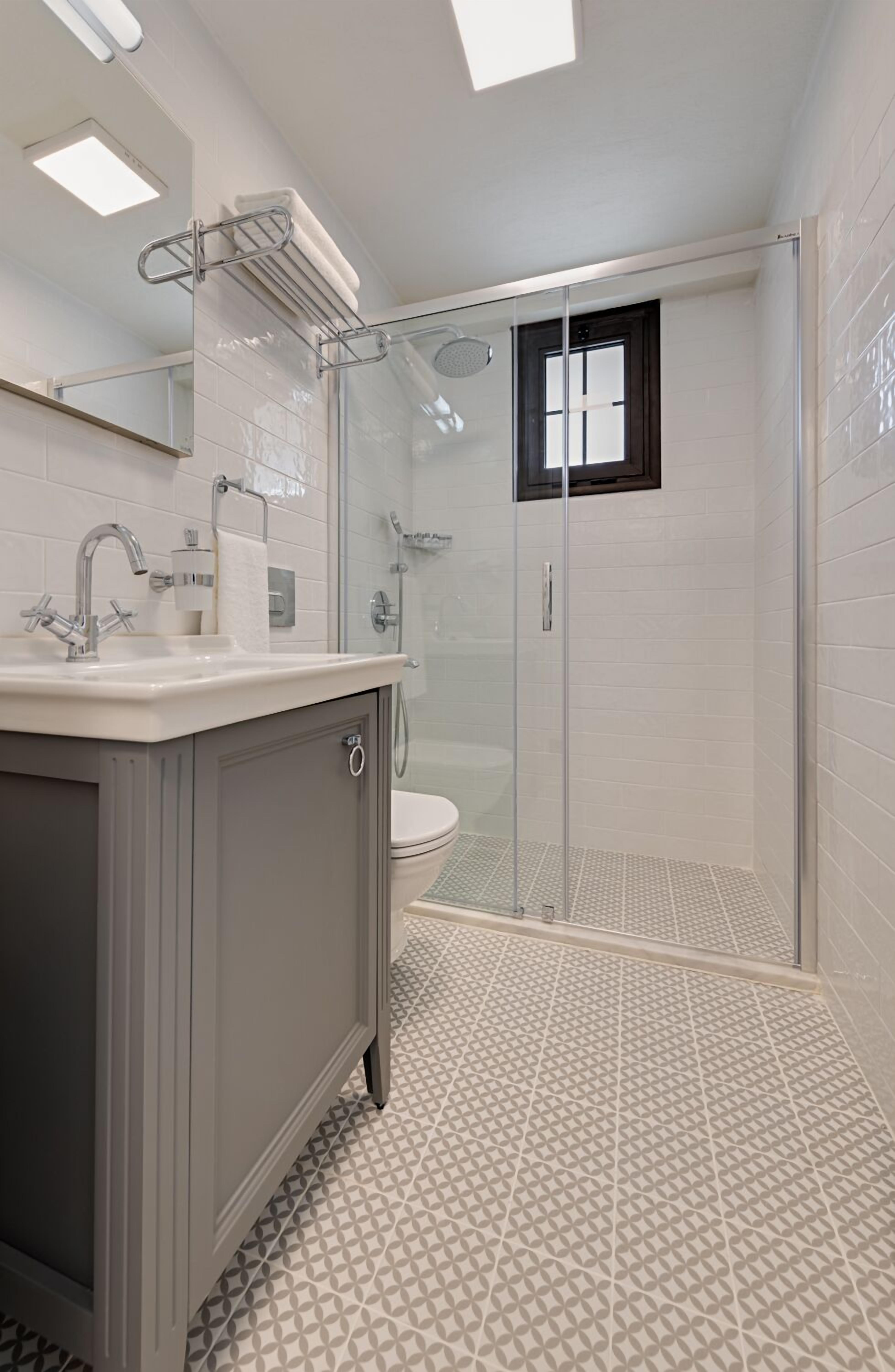 shower, hair dryer, slippers, towels