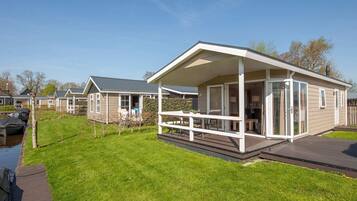 Relax on the spacious porch, enjoying the open view of the surrounding area.