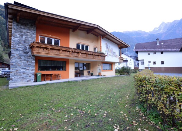 A two-story building with a stone facade, a balcony, and a sign that reads "Pensionhaus." - Apartment in Oetz Near Ski Lift (Oetz)