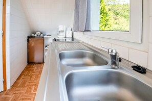 Appartement | Cuisine privée | Chaise haute