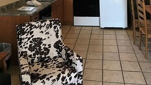 A kitchen with wooden cabinets, a stove, a microwave, and a ceiling fan. - **LakeViewCondo! Boat Slip Included! Steps2Lake** (Kingsland)