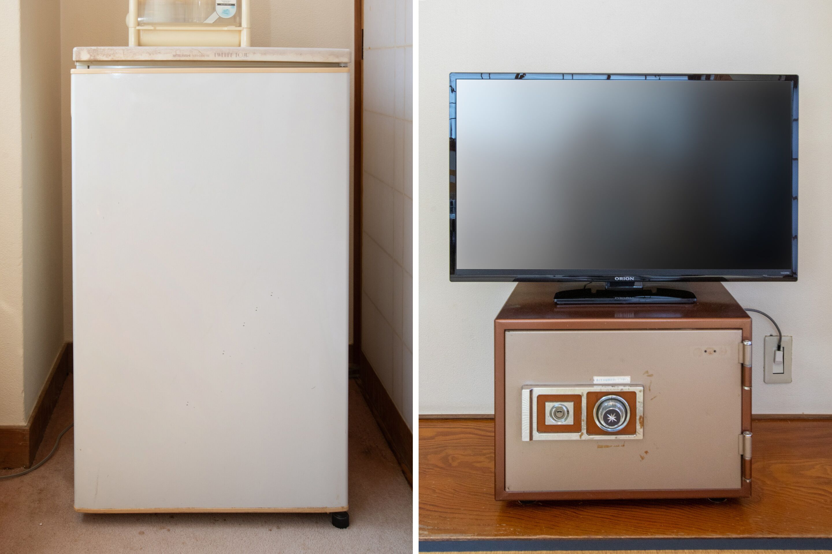 A white refrigerator and a television on a wooden cabinet.