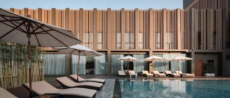 2 outdoor pools, open 6:00 AM to 10:00 PM, pool umbrellas, pool loungers