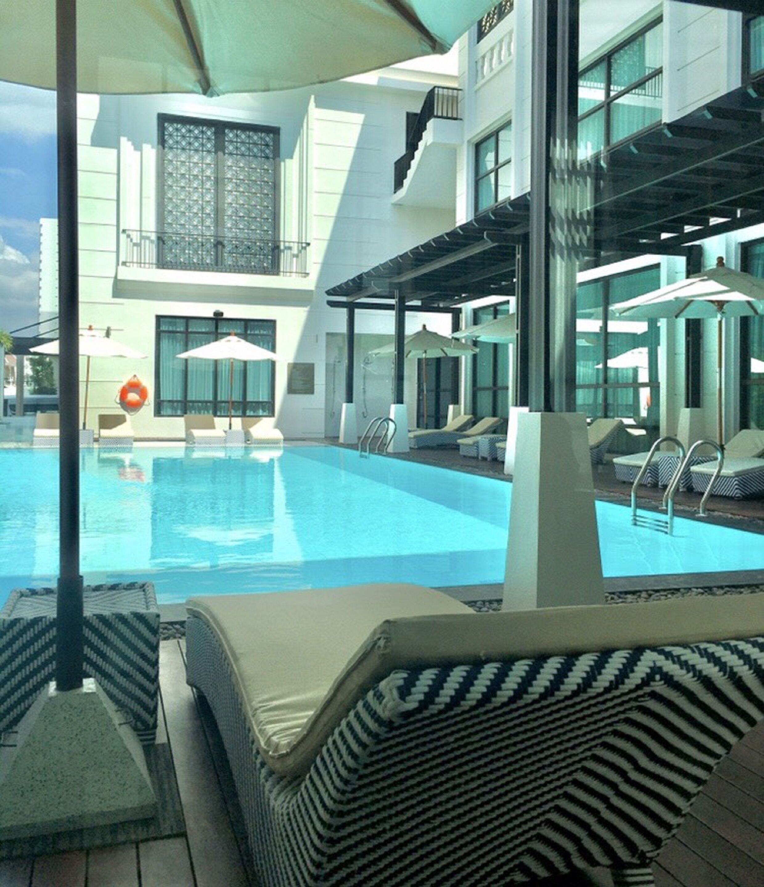 2 outdoor pools, open 6:00 AM to 10:00 PM, pool umbrellas, sun loungers