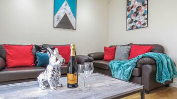 Business Townhome | Living area | 50-inch Smart TV with digital channels, TV