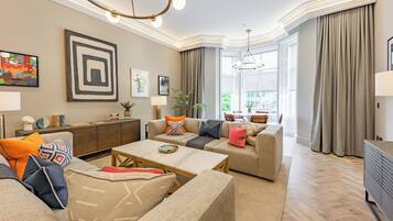 Deluxe 2-Bedroom Apartment - 2 bedrooms (1 King or 2 Singles) | Living area | Smart TV