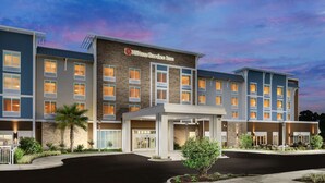 A Hilton Garden Inn with a modern facade, multiple floors, and a well-lit entrance. - Hilton Garden Inn Apopka City Center (Apopka)